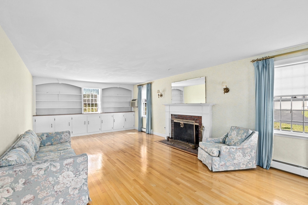12 Pine Grove Road Hingham, MA 02043 - Photo 12 of 32 a living room with furniture and a fireplace
