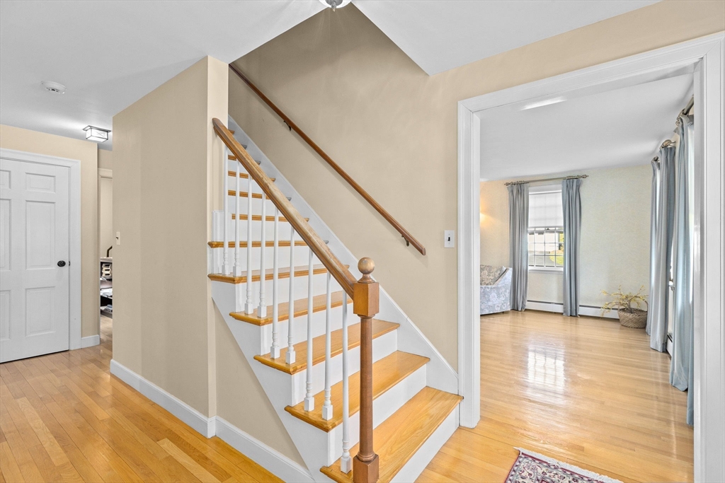 12 Pine Grove Road Hingham, MA 02043 - Photo 14 of 32 a view of an entryway with wooden floor and door