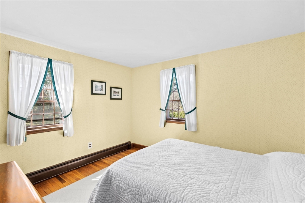 12 Pine Grove Road Hingham, MA 02043 - Photo 15 of 32 a bedroom with a bed and a window