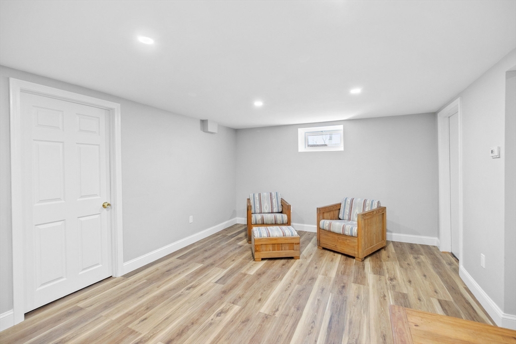 12 Pine Grove Road Hingham, MA 02043 - Photo 26 of 32 a living room with couch chairs and a wooden floor