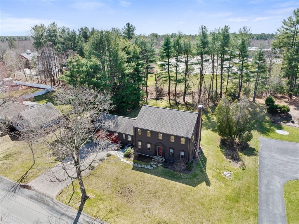 12 Pine Grove Road Hingham, MA 02043 - Photo 27 of 32 a view of a swimming pool and trees in the background