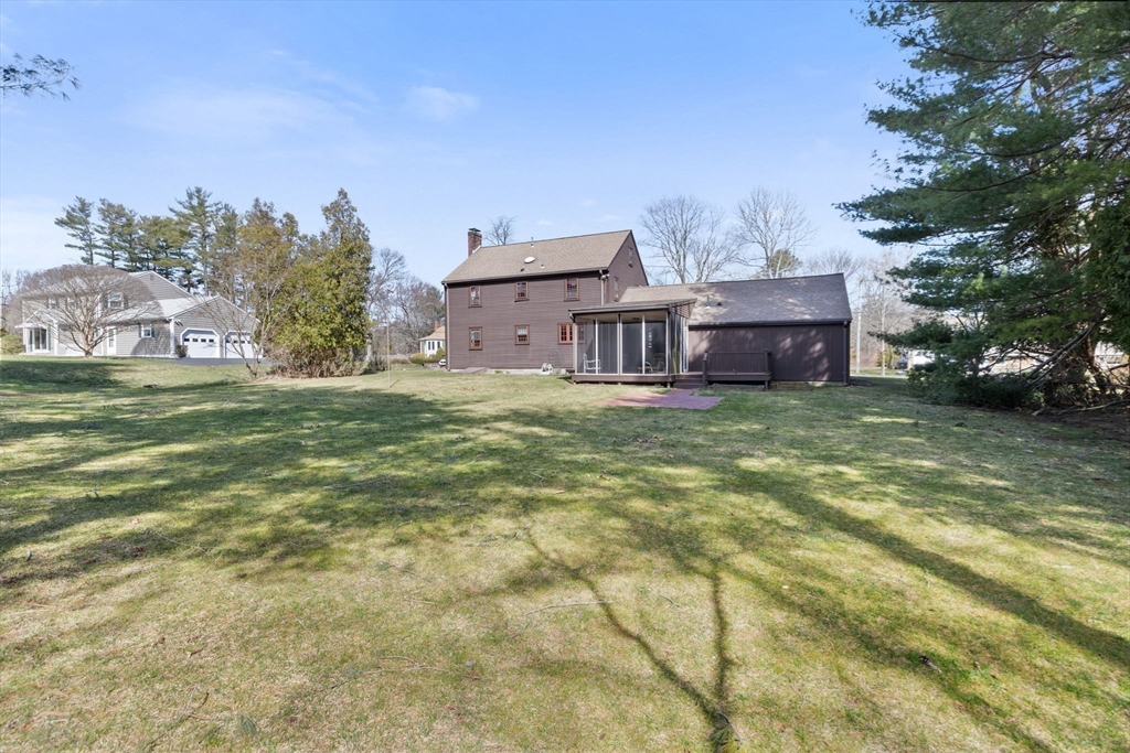 12 Pine Grove Road Hingham, MA 02043 - Photo 29 of 32 a view of a house with a big yard and large trees