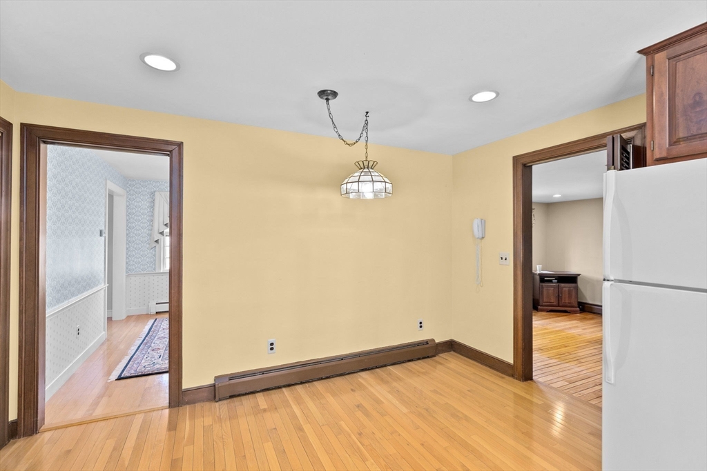12 Pine Grove Road Hingham, MA 02043 - Photo 6 of 32 a view of a room with a refrigerator and wooden floor