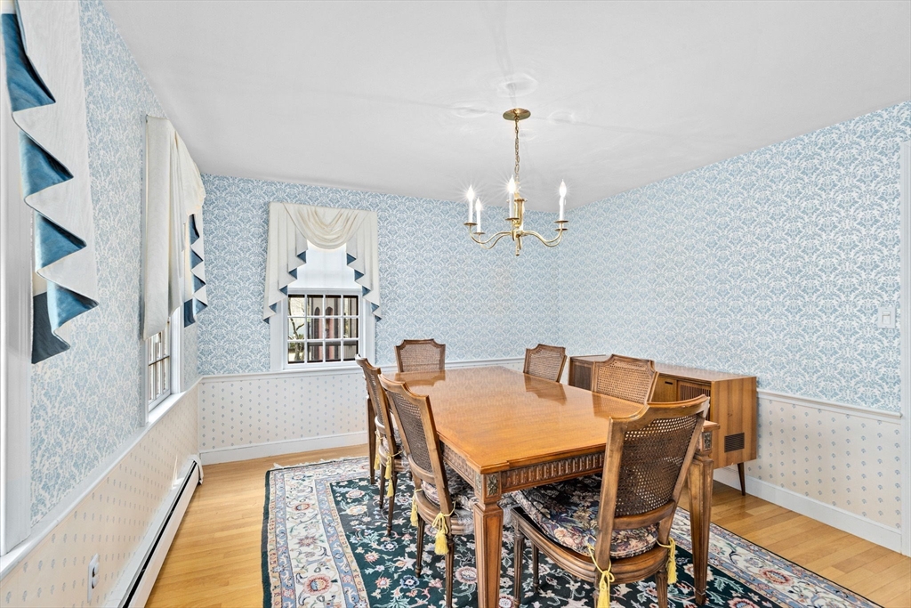 12 Pine Grove Road Hingham, MA 02043 - Photo 8 of 32 a view of a dining room with furniture and wooden floor