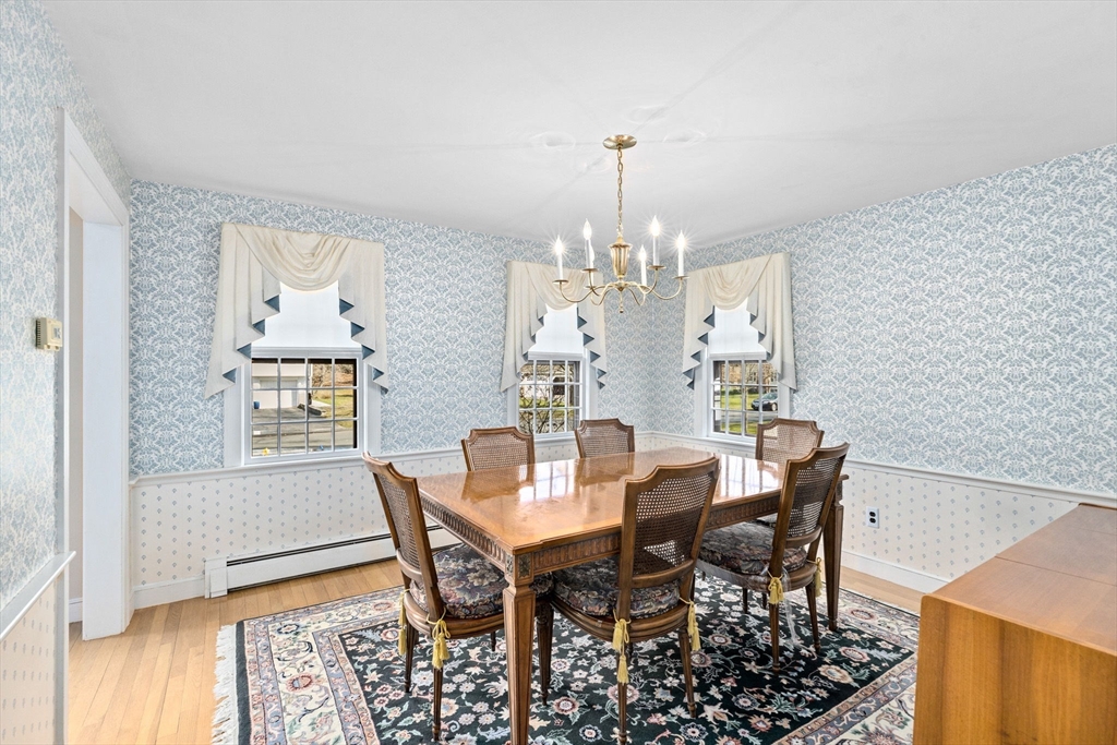 12 Pine Grove Road Hingham, MA 02043 - Photo 9 of 32 a view of a dining room with furniture and wooden floor
