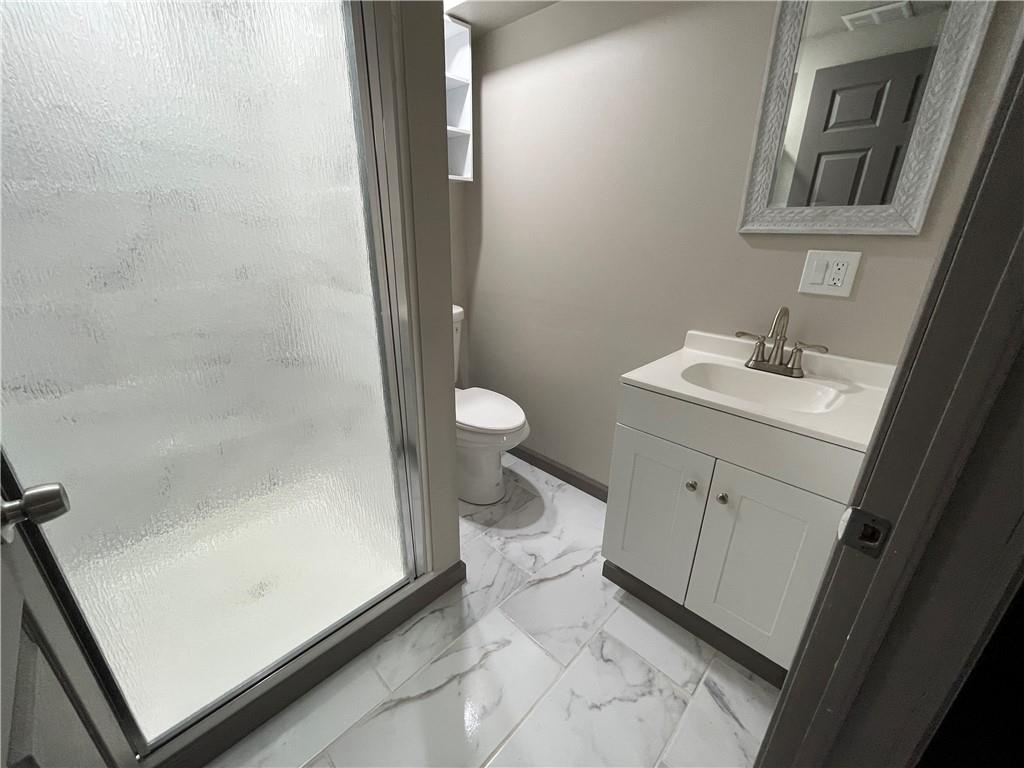 500 Scene Ridge Road McKeesport, PA 15133 - Photo 17 of 26 a bathroom with a granite countertop sink toilet and shower