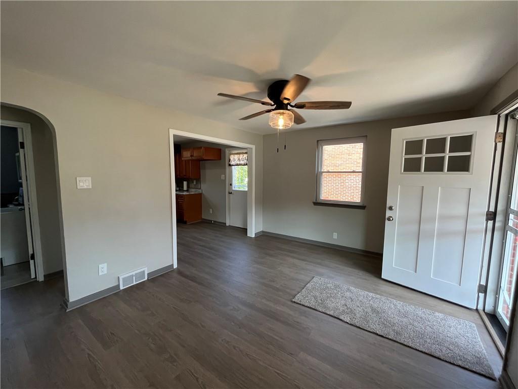 500 Scene Ridge Road McKeesport, PA 15133 - Photo 5 of 26 an empty room with wooden floor and windows