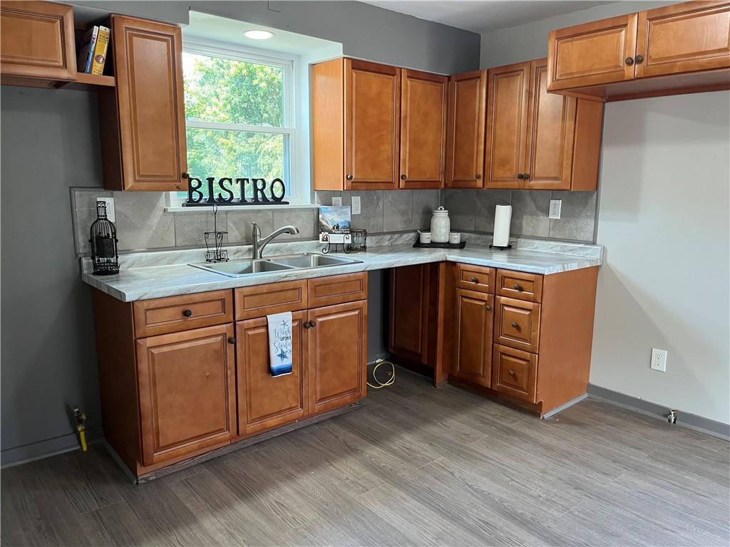 500 Scene Ridge Road McKeesport, PA 15133 - Photo 10 of 26 a kitchen with stainless steel appliances granite countertop a stove a sink dishwasher and cabinets