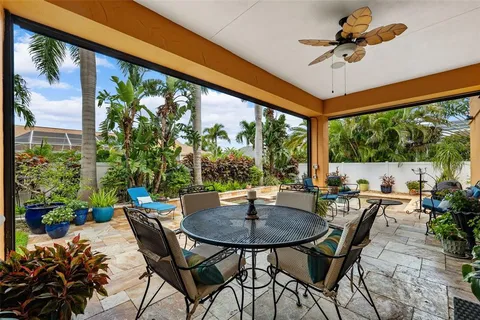 a kitchen with stainless steel appliances granite countertop a sink a stove and a wooden floors
