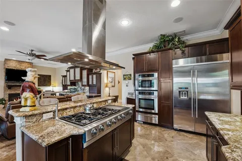 a living room with fireplace furniture and a flat screen tv