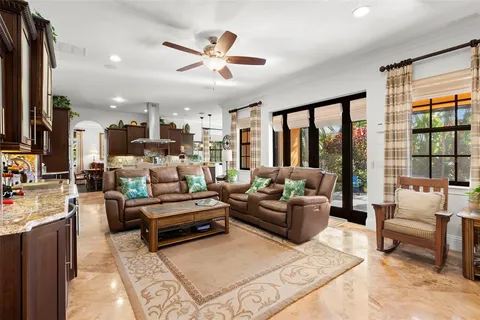 a bathroom with a granite countertop sink toilet a mirror and shower