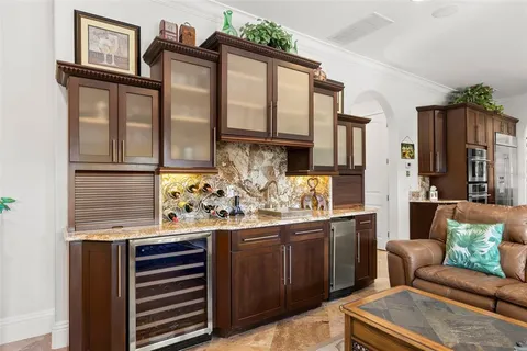 a view of a livingroom with furniture wooden floor and windows