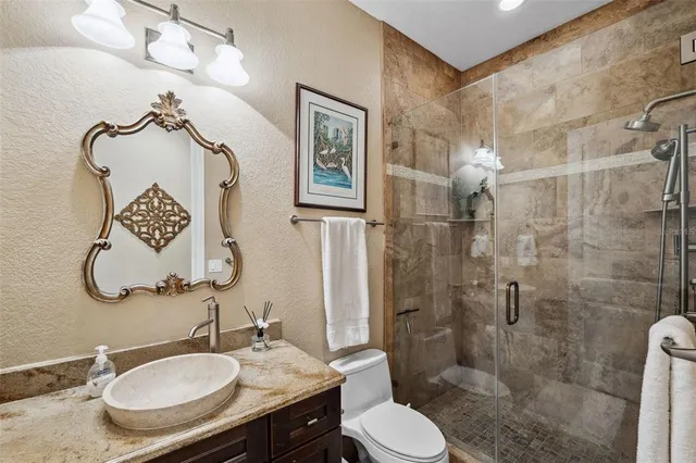 a view of a hallway with wooden floor and furniture