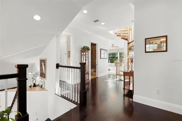 a bedroom with a bed window and a flat screen tv