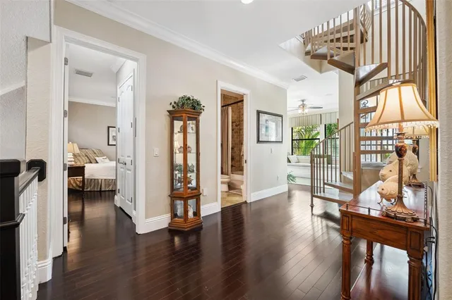 a spacious bedroom with a bed and a chandelier
