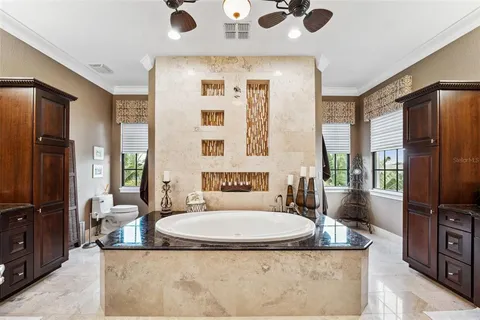 a bathroom with a toilet a sink and a shower