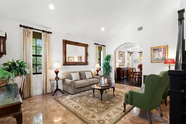 a living room with furniture and a rug