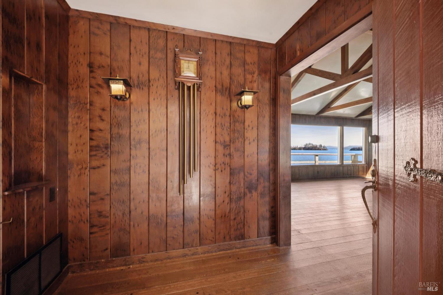 836 Point San Pedro Road San Rafael, CA 94901 - Photo 27 of 83 a view of a hallway with wooden shelves