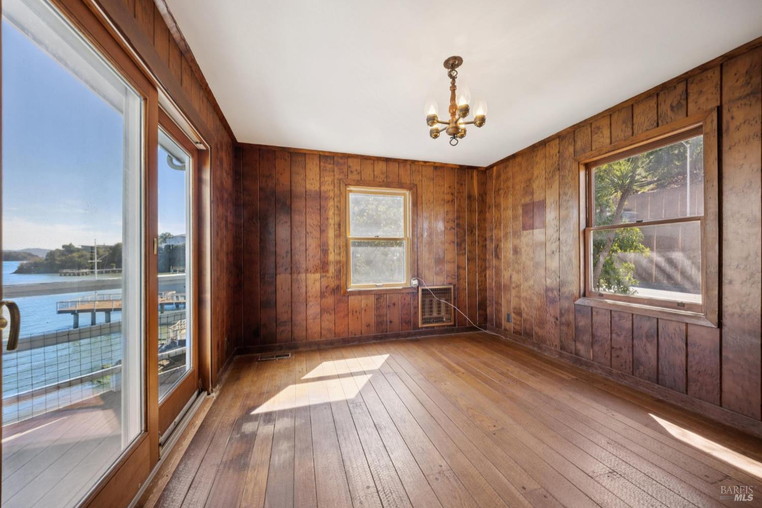 836 Point San Pedro Road San Rafael, CA 94901 - Photo 33 of 83 wooden floor in an empty room with a window
