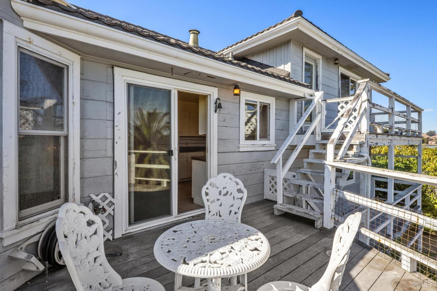 836 Point San Pedro Road San Rafael, CA 94901 - Photo 40 of 83 a view of a house with large windows and couches