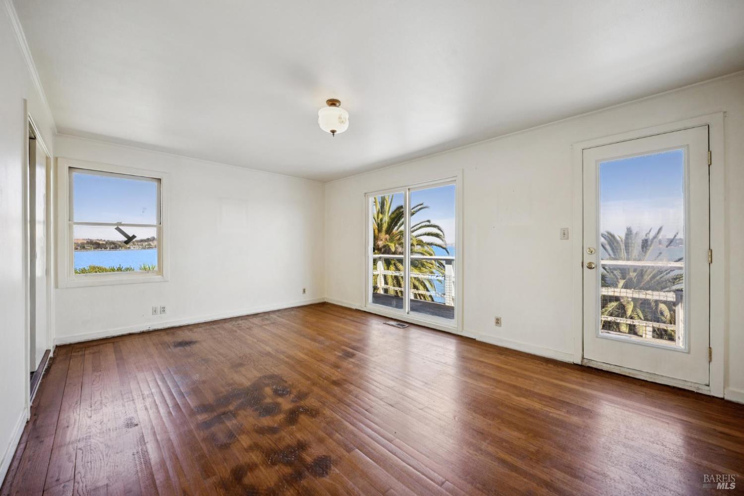 836 Point San Pedro Road San Rafael, CA 94901 - Photo 44 of 83 an empty room with window and wooden floor
