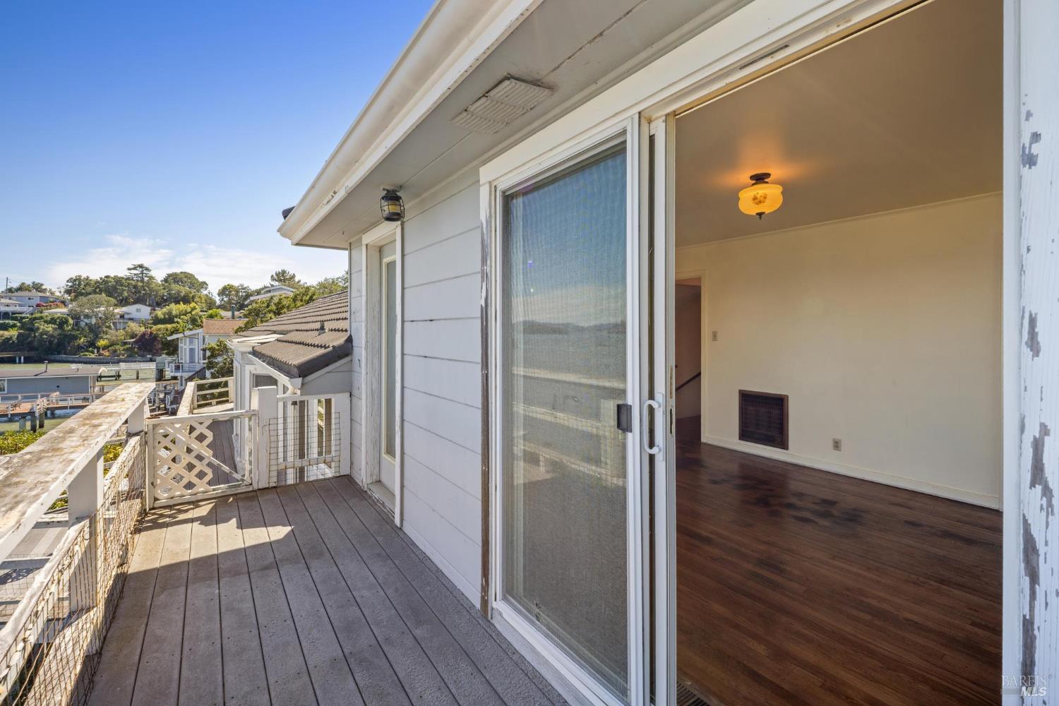 836 Point San Pedro Road San Rafael, CA 94901 - Photo 47 of 83 a view of a balcony with wooden floor and fence