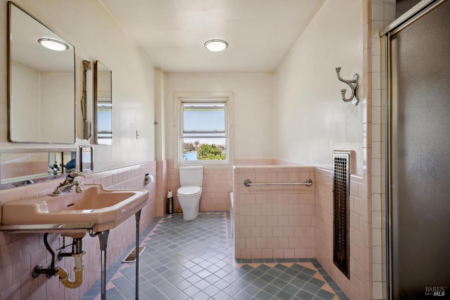 836 Point San Pedro Road San Rafael, CA 94901 - Photo 50 of 83 a spacious bathroom with a sink a mirror and a toilet