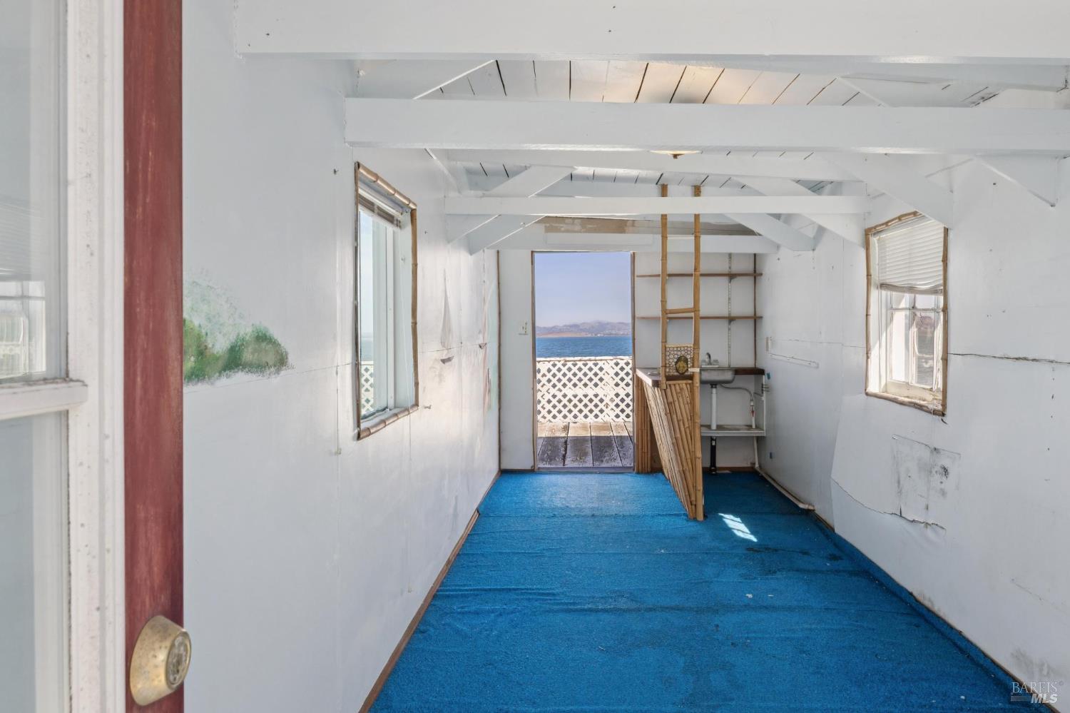 836 Point San Pedro Road San Rafael, CA 94901 - Photo 68 of 83 a view of a hallway view with wooden floor and staircase