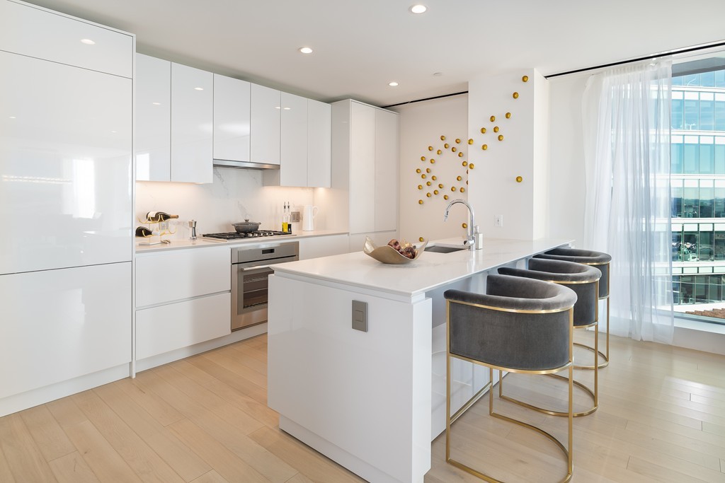 133 Seaport Boulevard, Unit 1017 Boston, MA 02210 - Photo 6 of 17 a kitchen with a sink cabinets and window