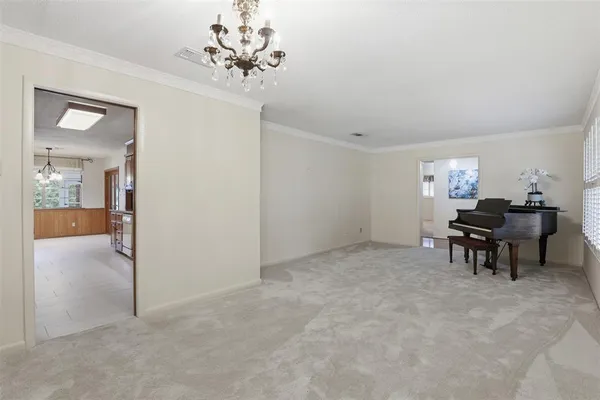 an empty room with closet and a ceiling fan