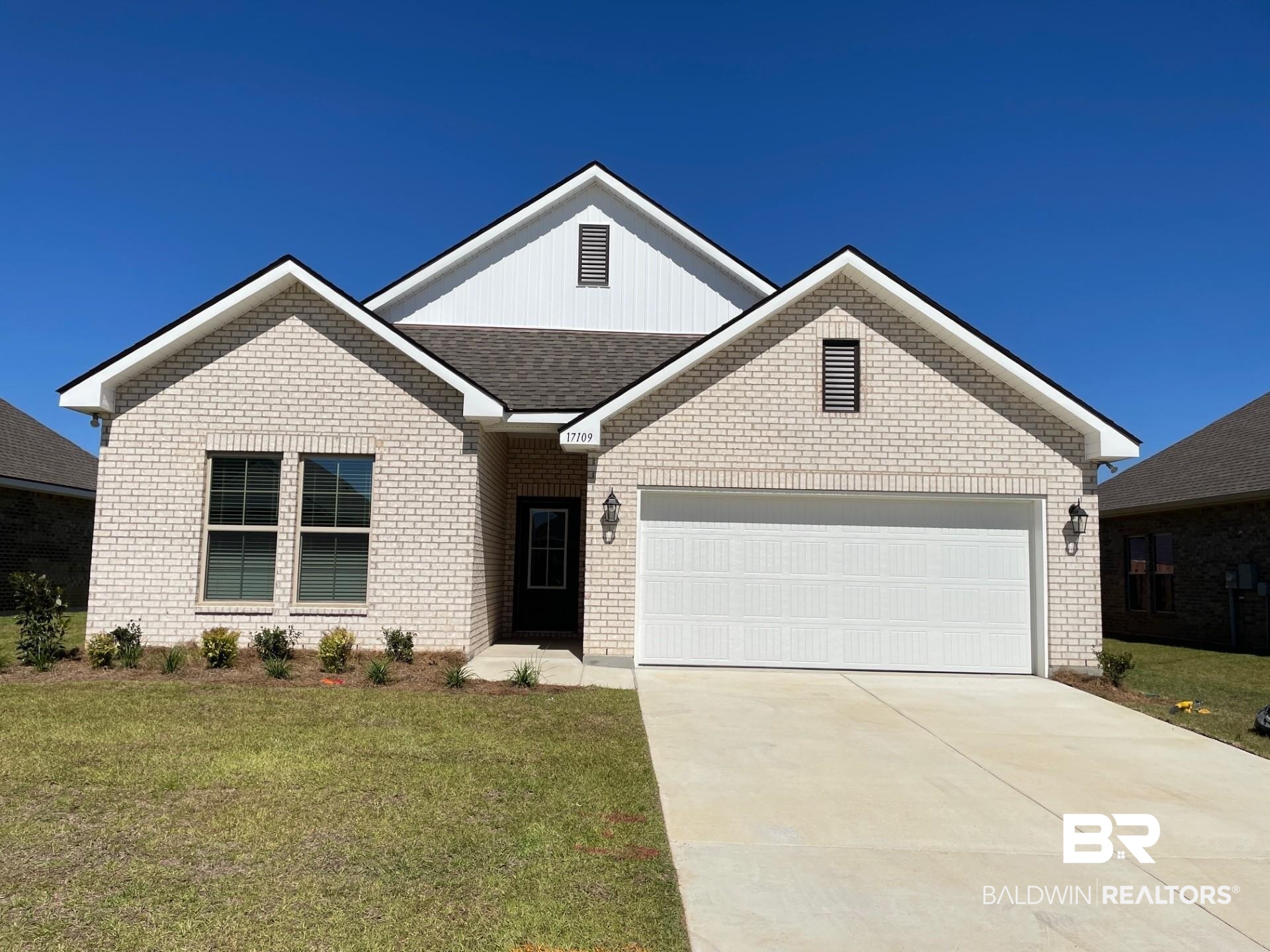 17109 Delta Avenue Robertsdale, AL 36567 - Photo 1 of 3 View of front of property featuring a front yard and a garage