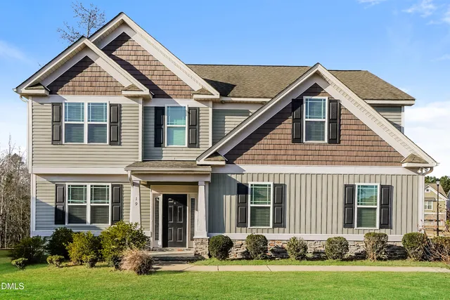 front view of a house with a yard