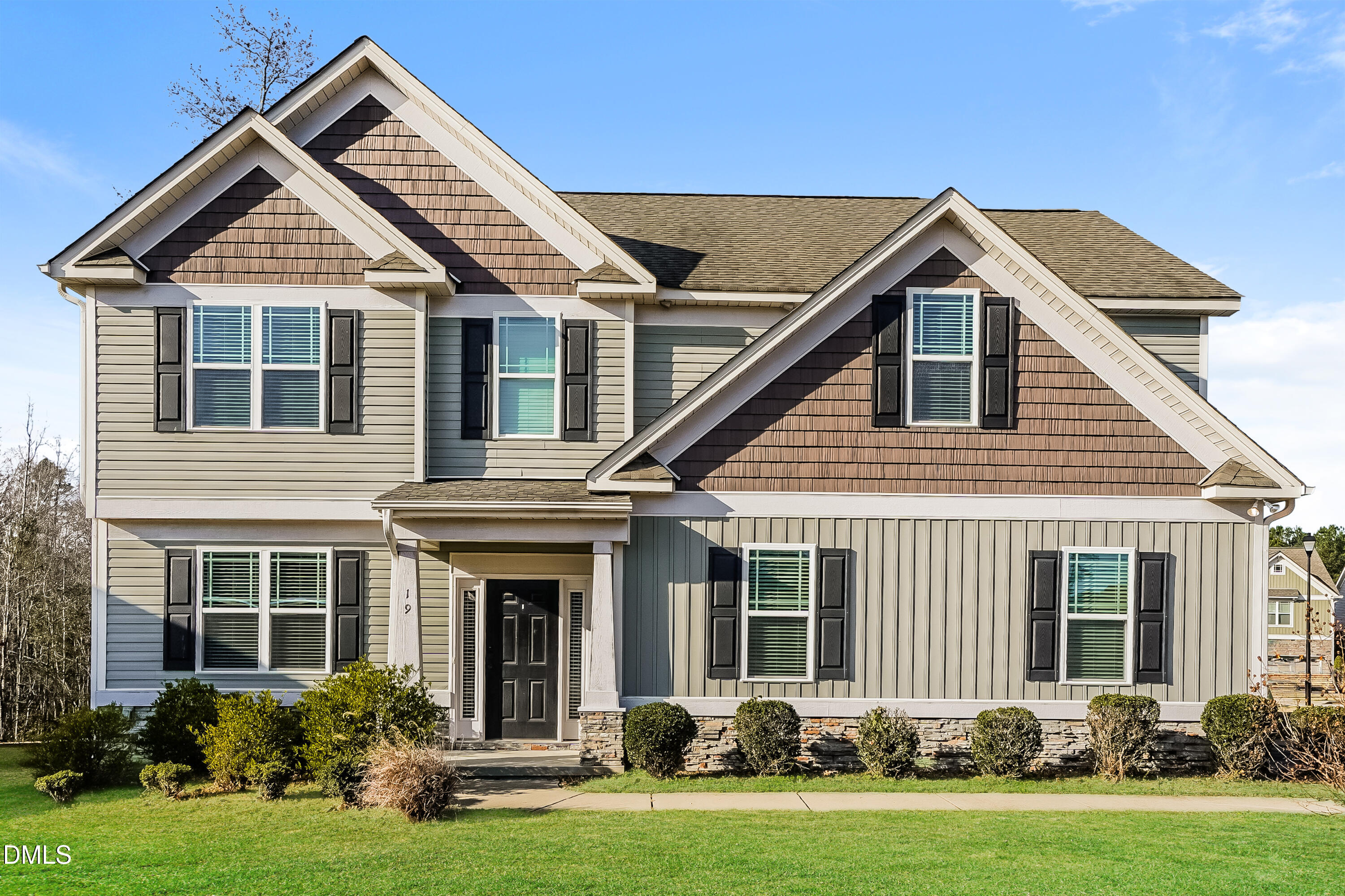 front view of a house with a yard