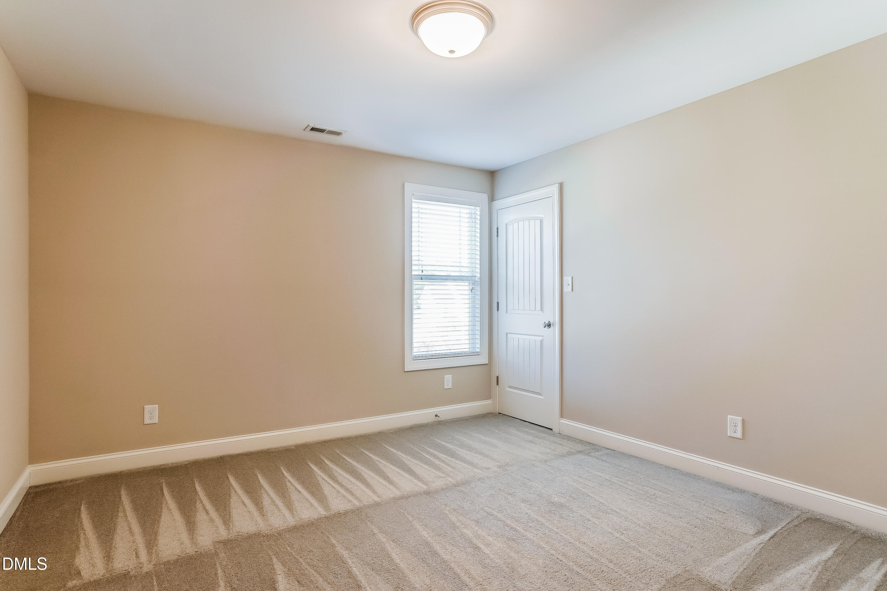 19 Labradoodle Court Garner, NC 27529 - Photo 12 of 17 an empty room with a window