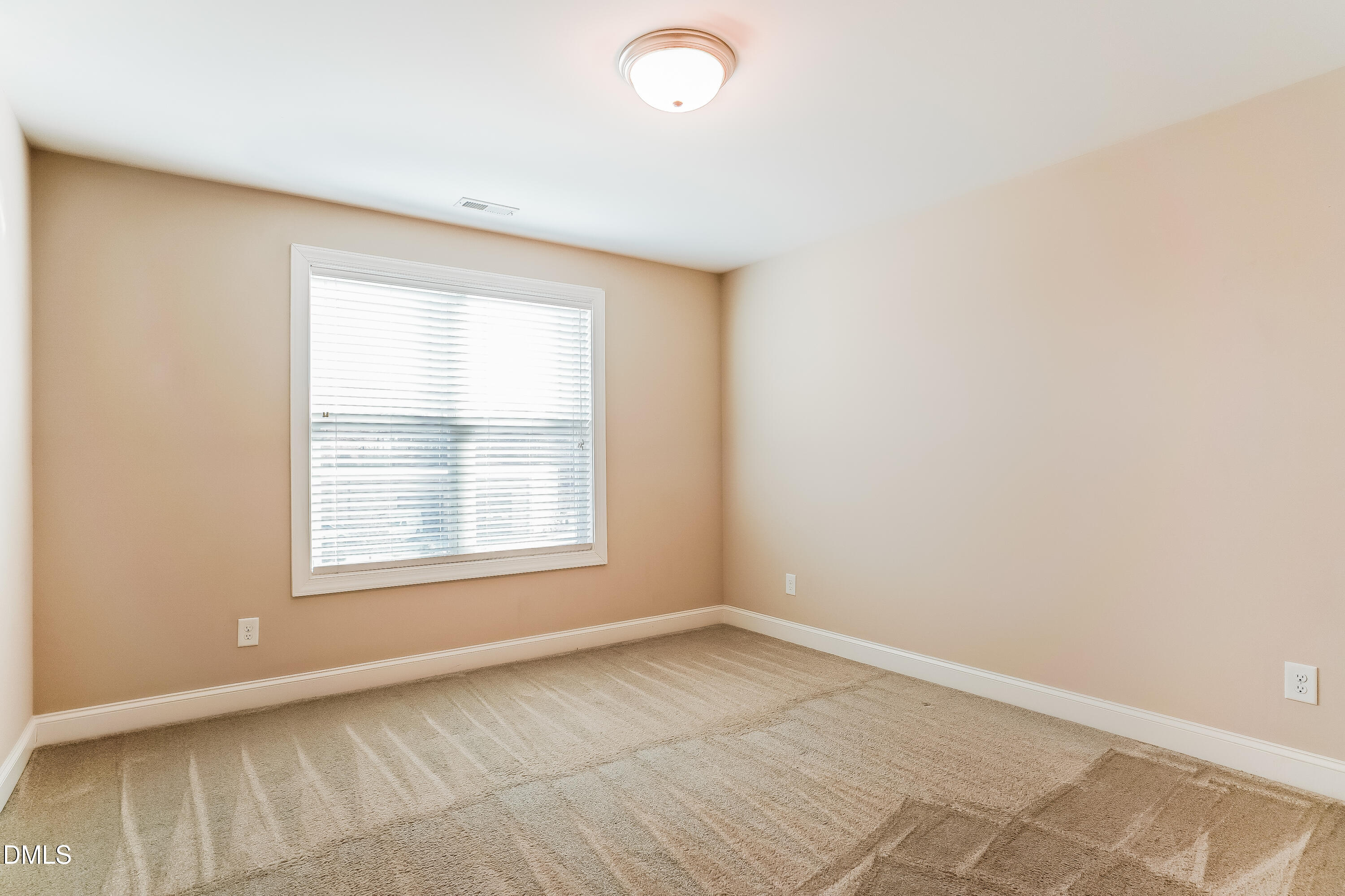 19 Labradoodle Court Garner, NC 27529 - Photo 13 of 17 an empty room with a window