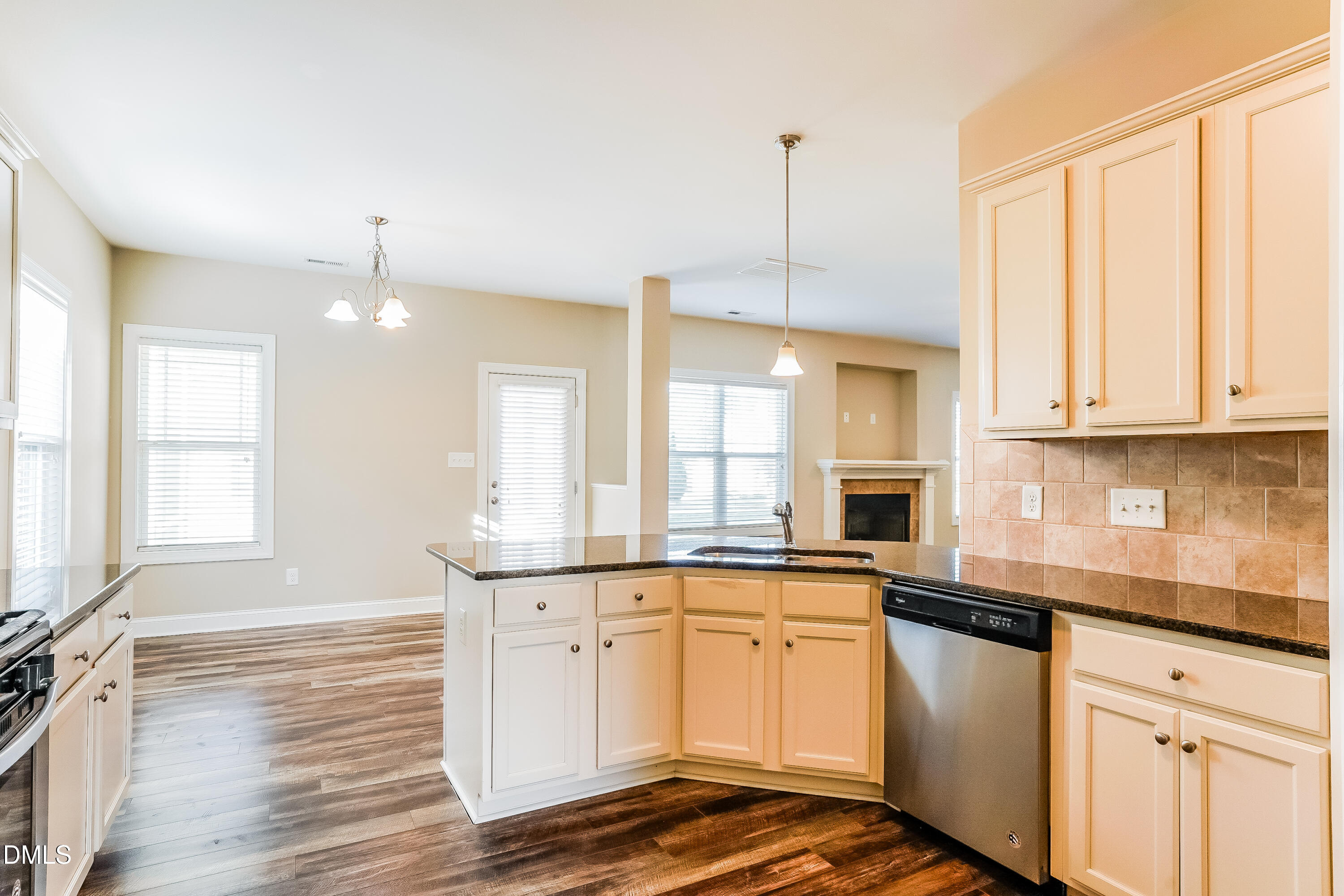 19 Labradoodle Court Garner, NC 27529 - Photo 7 of 17 a kitchen with stainless steel appliances granite countertop a sink a stove and cabinets