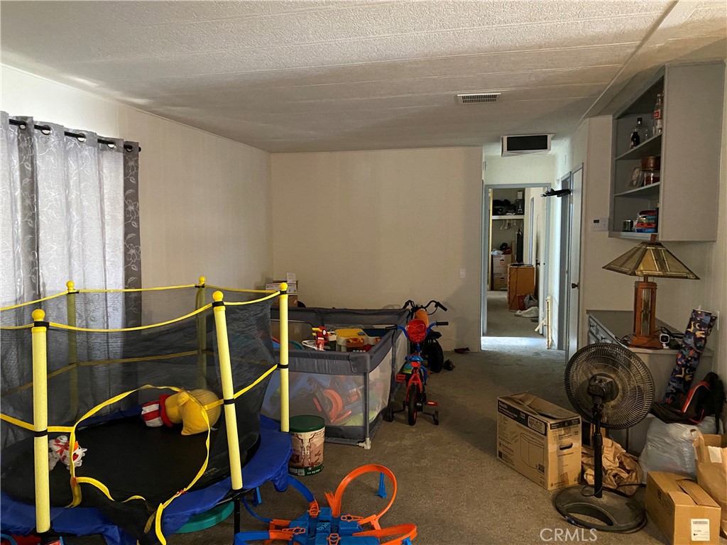 20683 Waalew Road, Unit B161 Apple Valley, CA 92307 - Photo 15 of 30 Family Room Area with Shelves