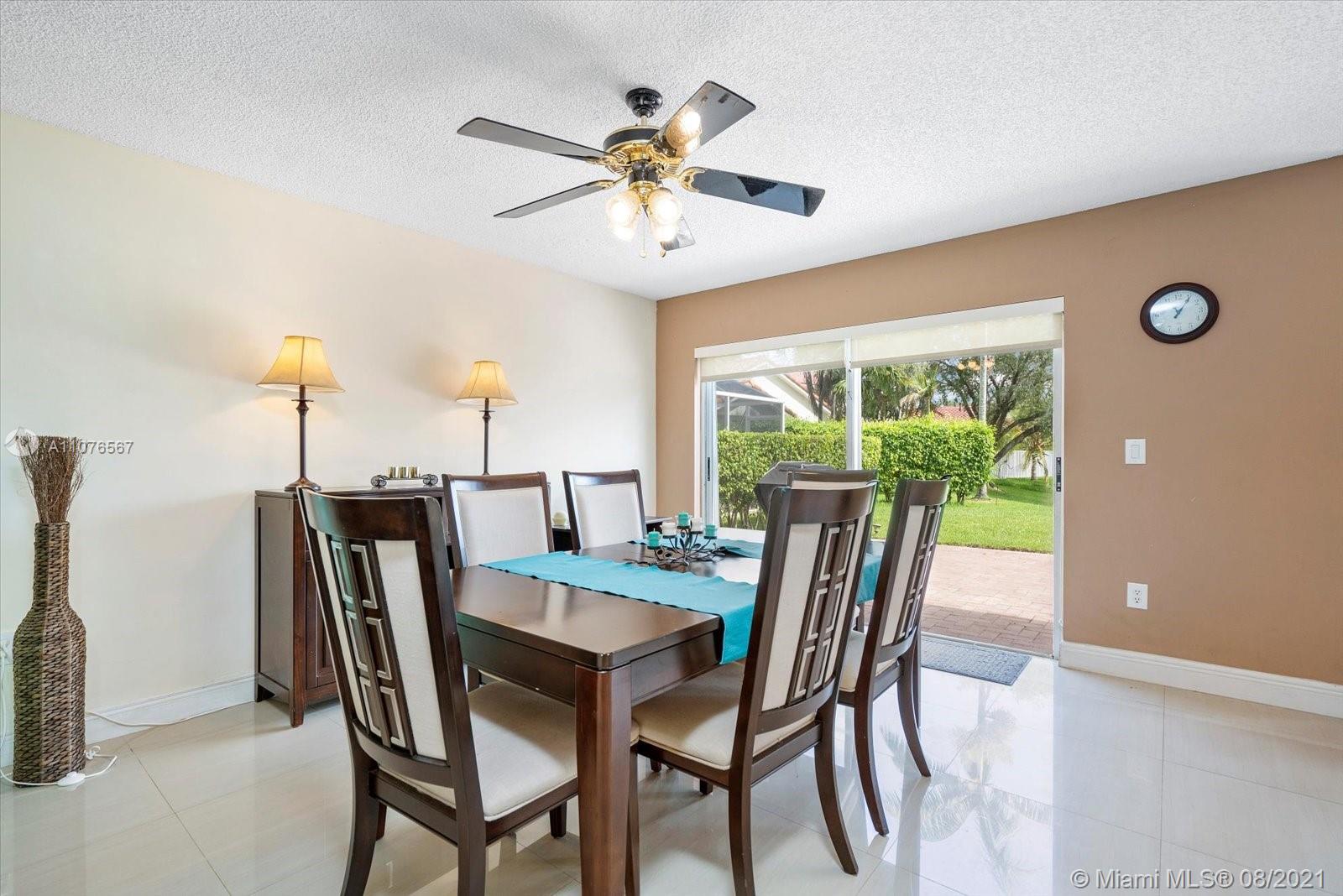 153 Granada Avenue Weston, FL 33326 - Photo 11 of 37 a dining room with furniture and window