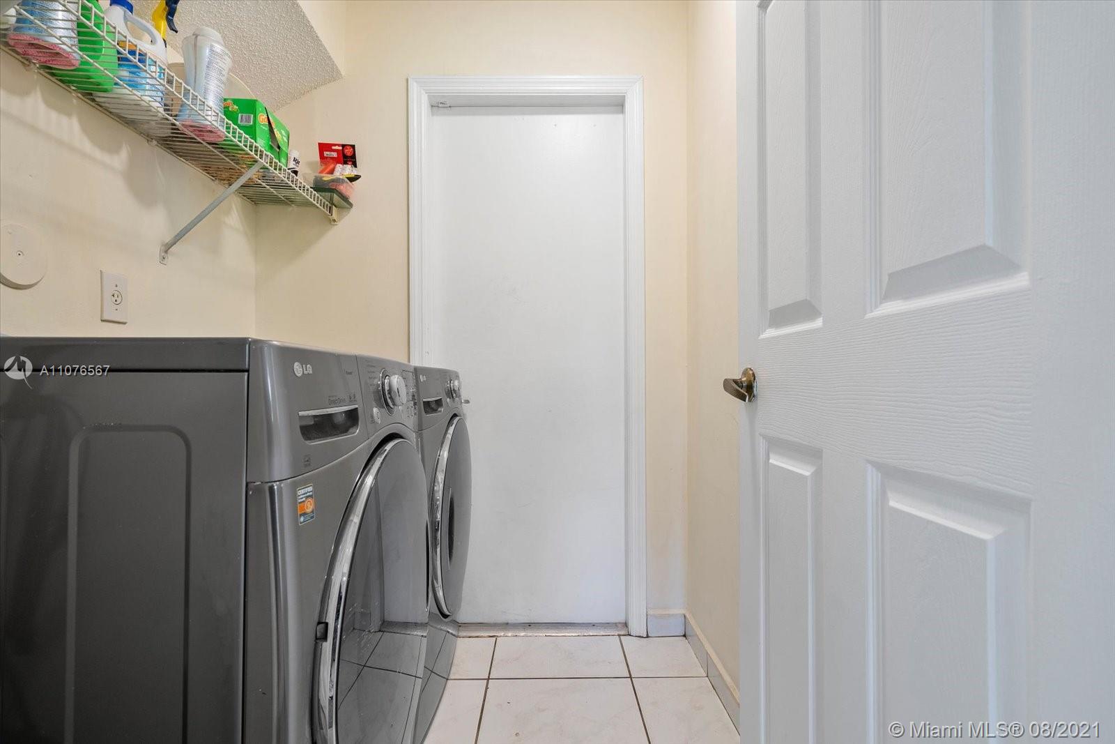 153 Granada Avenue Weston, FL 33326 - Photo 14 of 37 a utility room with dryer and washer