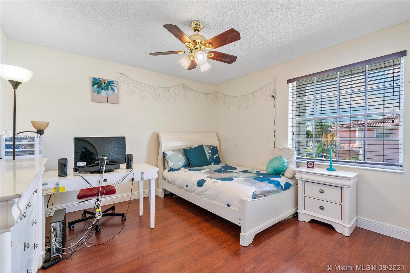 153 Granada Avenue Weston, FL 33326 - Photo 22 of 37 a bed room with a bed and a window
