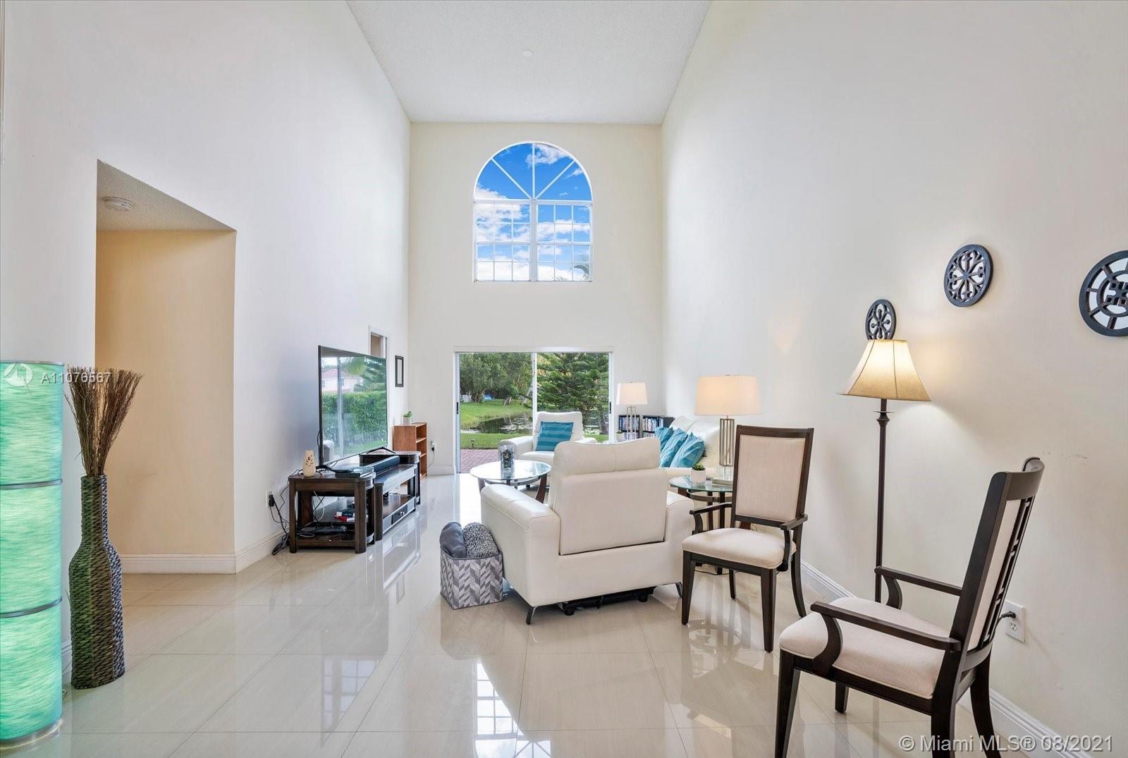 153 Granada Avenue Weston, FL 33326 - Photo 4 of 37 a living room with furniture and a window
