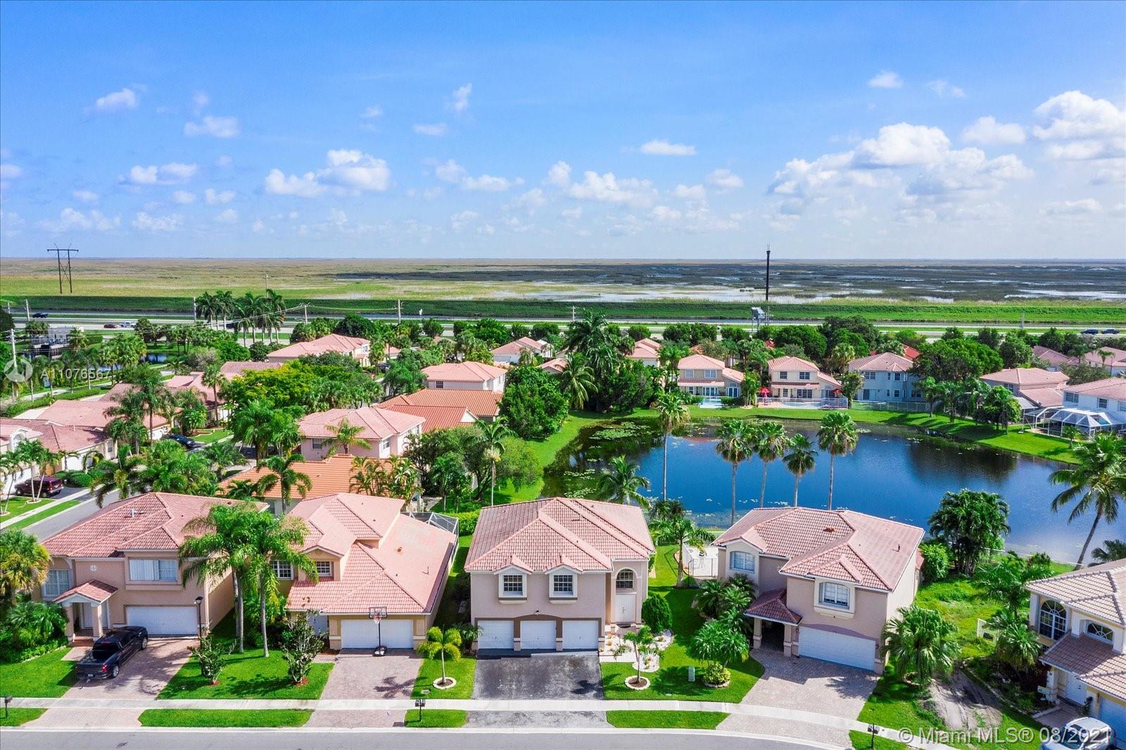 153 Granada Avenue Weston, FL 33326 - Photo 34 of 37 an aerial view of a houses with outdoor space
