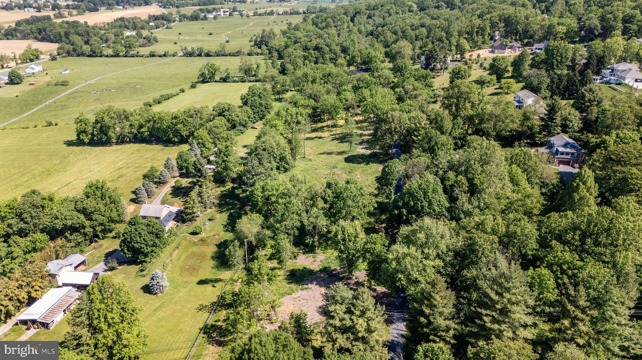 4422 Teen Barnes Road Frederick, MD 21703 - Photo 6 of 10 an aerial view of residential houses with outdoor space and trees