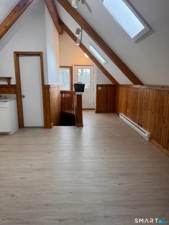 a view of entryway with wooden floor