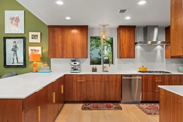 a kitchen with a sink and cabinets