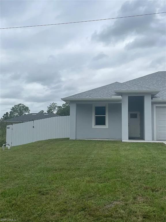 742 Eisenhower Boulevard Lehigh Acres, FL 33974 - Photo 1 of 11 a view of a backyard