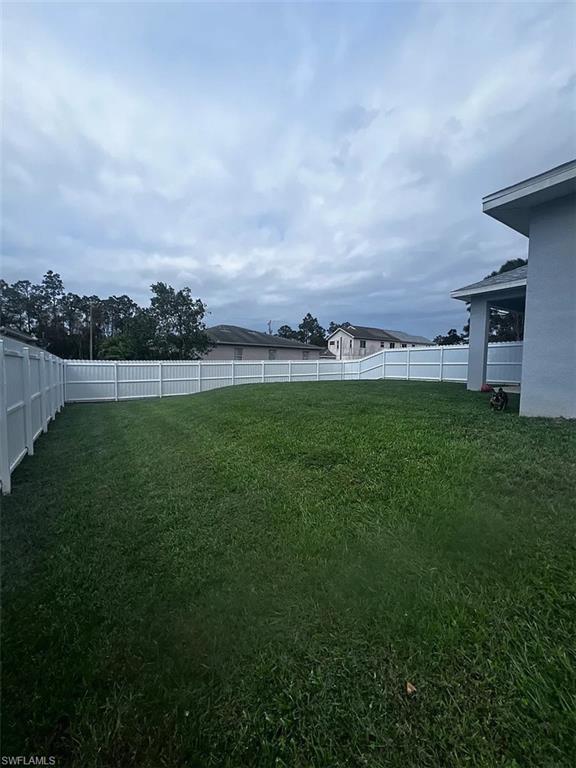 742 Eisenhower Boulevard Lehigh Acres, FL 33974 - Photo 2 of 11 a view of outdoor space and yard