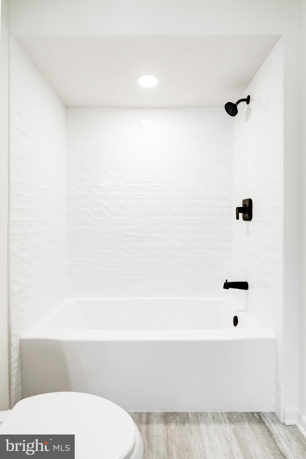 163 Thomas Place Reading, PA 19608 - Photo 24 of 36 a bathroom with a bathtub and a toilet