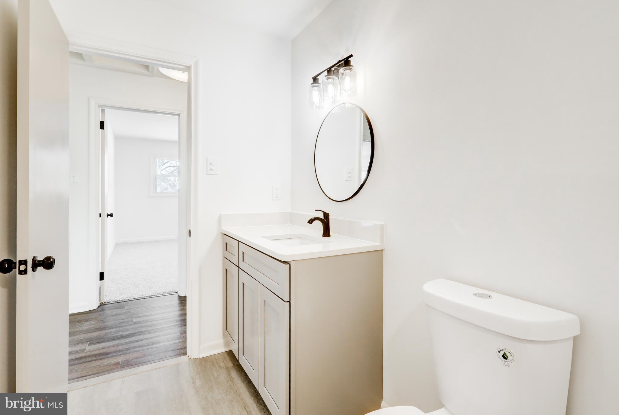 163 Thomas Place Reading, PA 19608 - Photo 26 of 36 a bathroom with a sink a toilet and shower