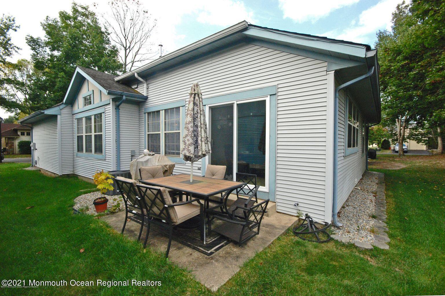 32 Waverly Lane Jackson, NJ 08527 - Photo 15 of 19 a backyard of a house with table and chairs